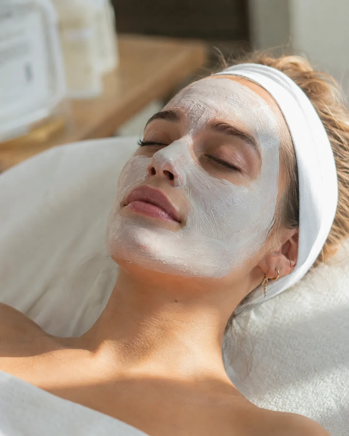 Client with a facial mask applied